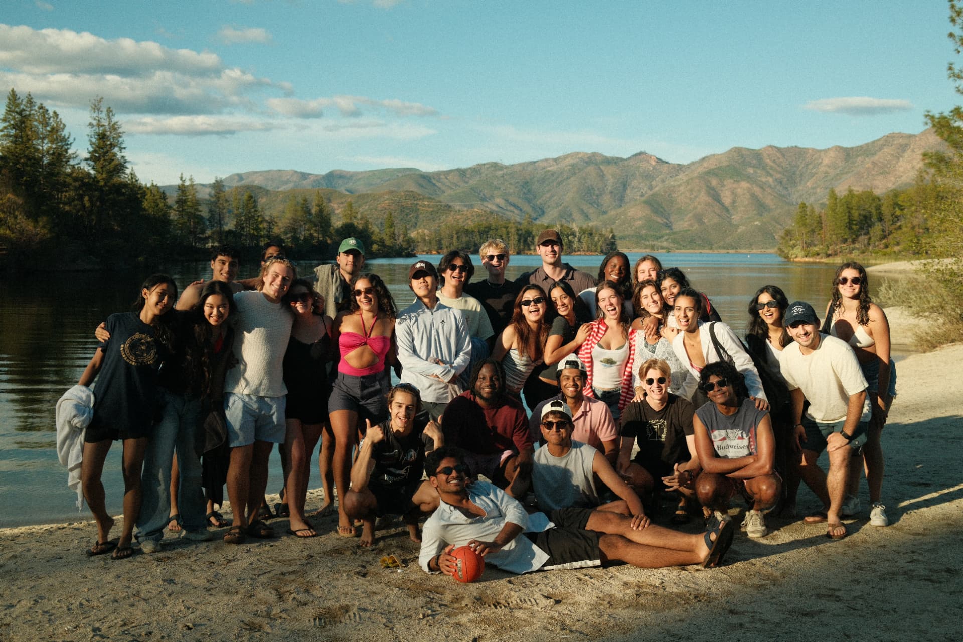 ISAB members together by a lake at sunset
